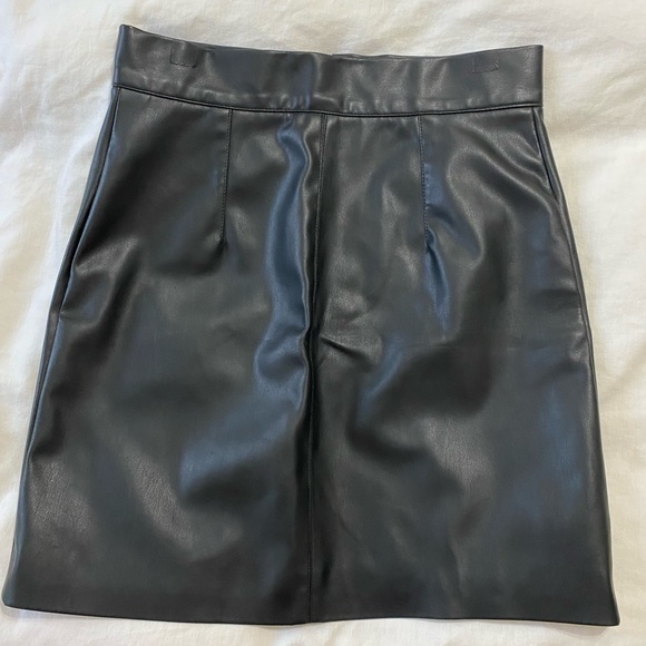 Black pleather, snap front mini skirt. - Picture 2 of 3